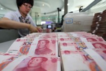 Yuan Edges Lower as PBOC Reports Higher FOREX Sales